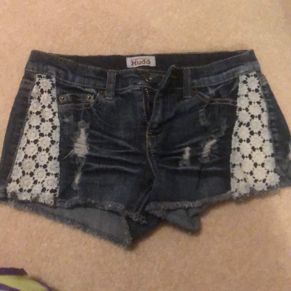 Dark blue jean shorts with lace.